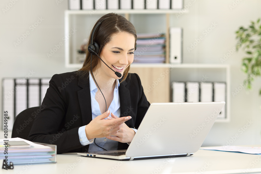 Teleoperator talking online with clients at office Teleoperator talking online with clients at office