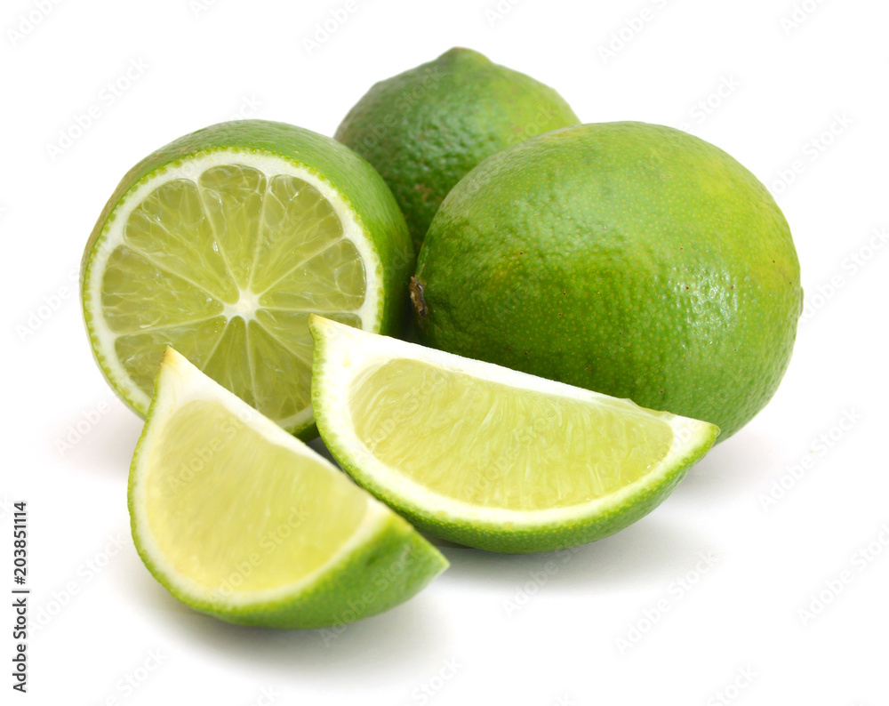 Whole lime and cut on white background. Whole lime and cut on white background.