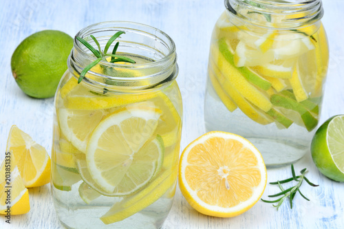 Water with fresh citrus and rosemary in a jars