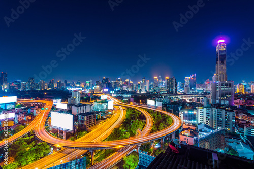 Cityscape and traffic at night in Bangkok, Thailand..
