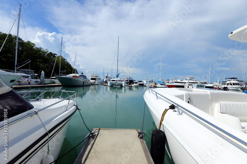 Luxury Yachts float on crystal clear sea in Marina Bay Club