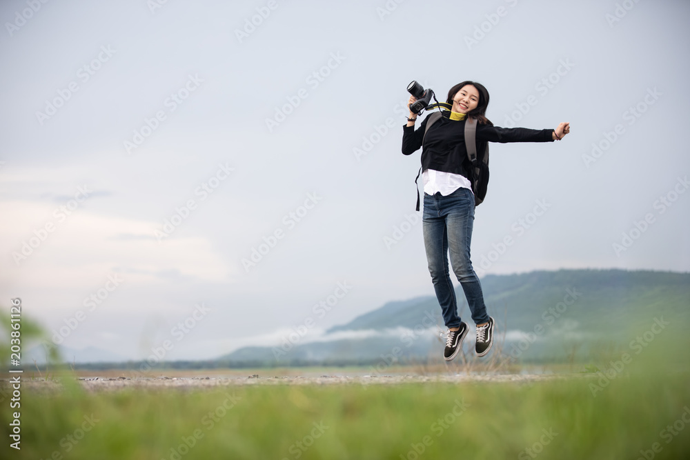 sian young women people Hiking with friends backpacks walking together and looking map and taking photo camera by the road and looking happy ,Relax time on holiday concept travel sian young women people Hiking with friends backpacks walking together and looking map and taking photo camera by the road and looking happy ,Relax time on holiday concept travel
