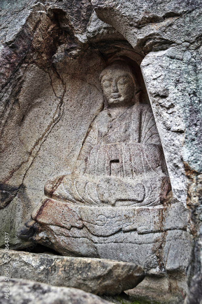 A statue of Buddha in Bulgok, Namsan Mountain, Gyeongju, Korea. A statue of Buddha in Bulgok, Namsan Mountain, Gyeongju, Korea.