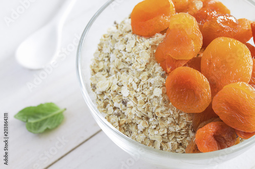 healthy breakfast of oatmeal with whole dried apricots