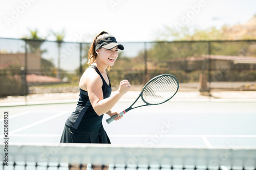 Tennis player pumping her fist