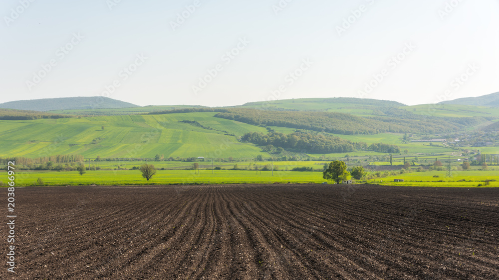 Plowed farmlands, arable fields