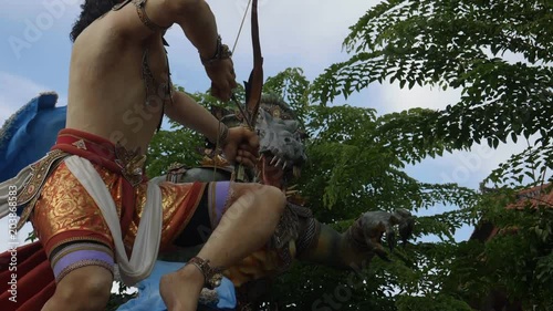 slow motion close up of a rotating ogoh-ogoh statue on a kuta street of bali photo