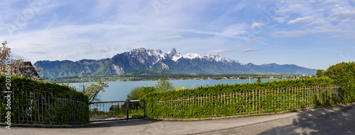 Stockhorn of Bernese Alps with lake Thun looking from street in village