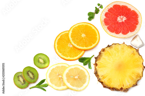 healthy background. slices of grapefruit  kiwi fruit  orange and pineapple isolated on white background top view