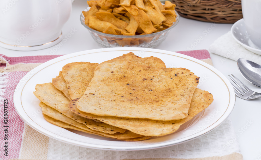 Indian Khakhra is a Traditional Gujarati Snack Also Know As Khakra, Crispy Roti or Fenugreek khakra, Khakhara’s are thin crackers made from wheat flour and oil. It is served usually during breakfast Indian Khakhra is a Traditional Gujarati Snack Also Know As Khakra, Crispy Roti or Fenugreek khakra, Khakhara’s are thin crackers made from wheat flour and oil. It is served usually during breakfast