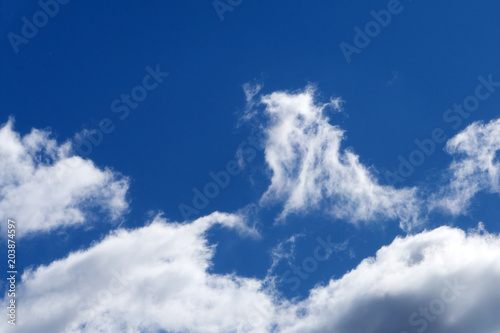blue sky background with tiny clouds . photo