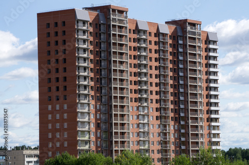Photography A group of high rise colorful residential apartments.