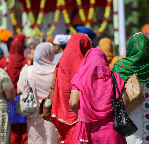 two young sikh women with colored dress in the street photo