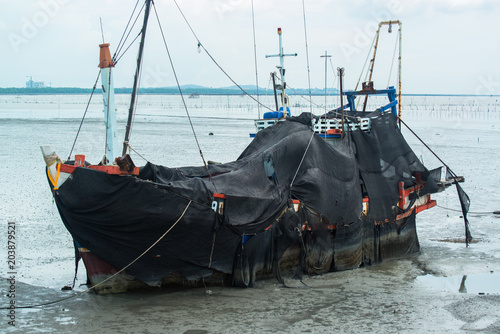 Fishing boat parked at sea port in Thailand.