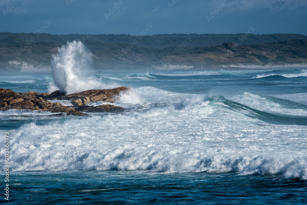 surf crashing over rocks, West Point Reserve