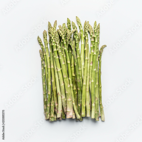 Green asparagus bunch on white background, top view, flat lay. Healthy  seasonal food