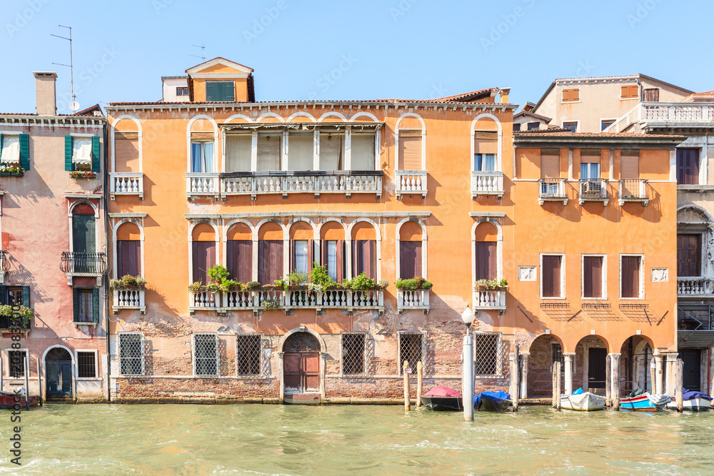 Picturesque summer view of Venice with famous water canals  and colorful historical buildings.