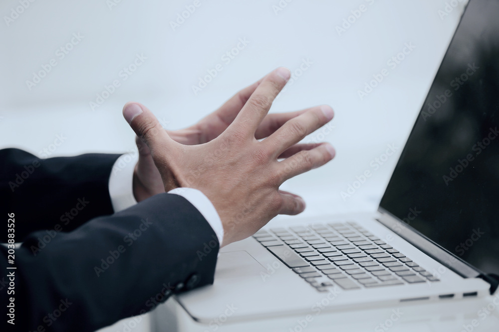 closeup.businessman looking at the laptop screen. closeup.businessman looking at the laptop screen.