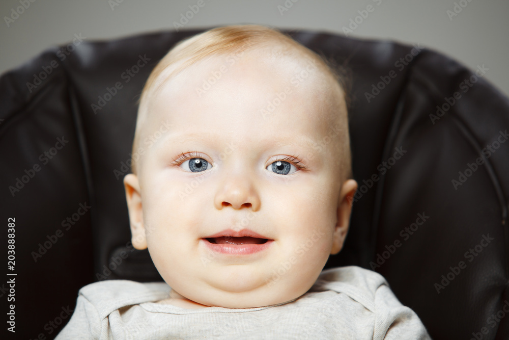 Adorable baby with plump cheeks and big eyes Adorable baby with plump cheeks and big eyes