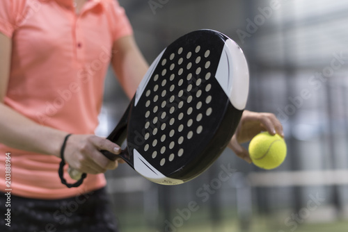 Paddle tennis player racket and ball ready for serve close up anonymous image © FotoAndalucia