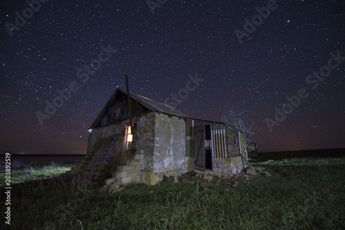 Little old stone house under the starry sky