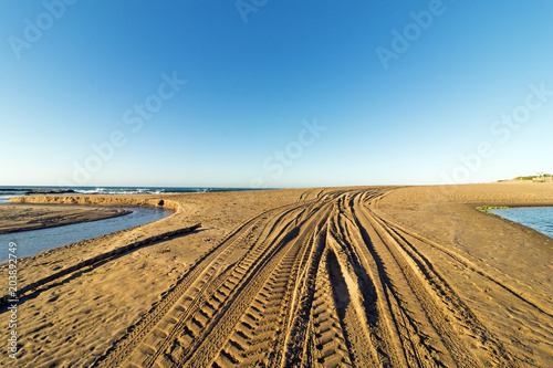 Patterns and Texture of Vehicle Tracks on Beach Sand