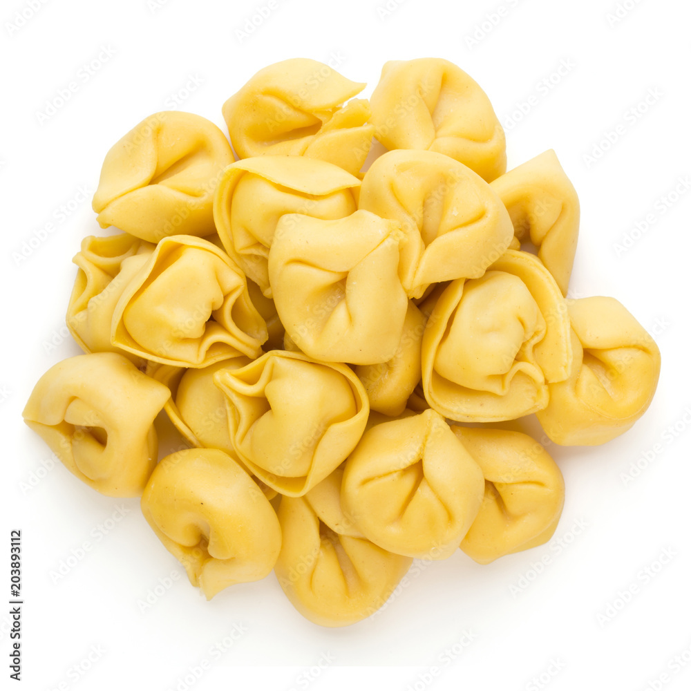 Raw homemade pasta,tortellini with herbs.