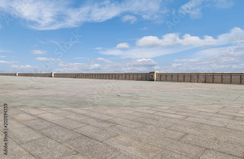 Empty square floor tiles and beautiful sky landscape