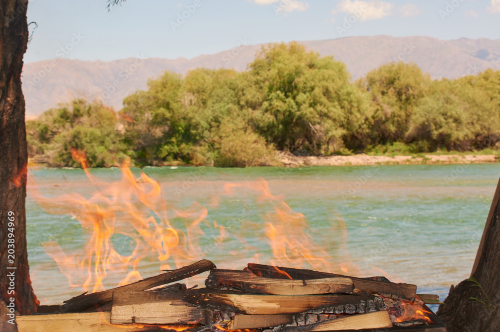 Naklejka premium fire by the river