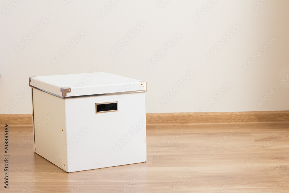 white box on the floor of empty room white box on the floor of empty room