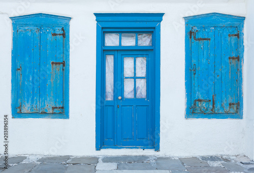 Old house with blue door and windows