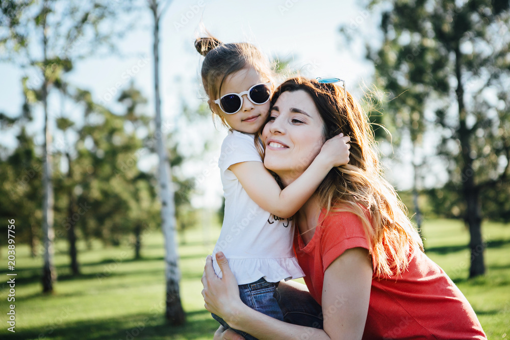 Mother hugs her dauhter. Mother hugs her dauhter.