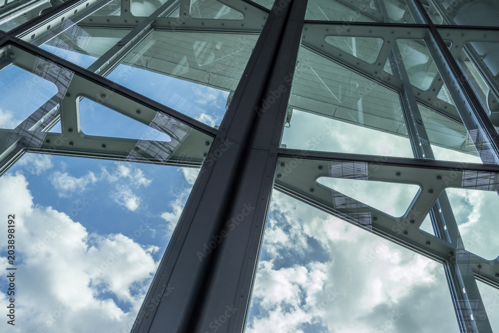 The glass architecture in city against a sky The glass architecture in city against a sky