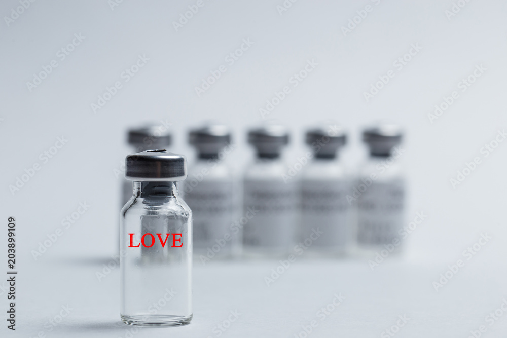 The inscription love in red letters on the vaccine The inscription love in red letters on the vaccine