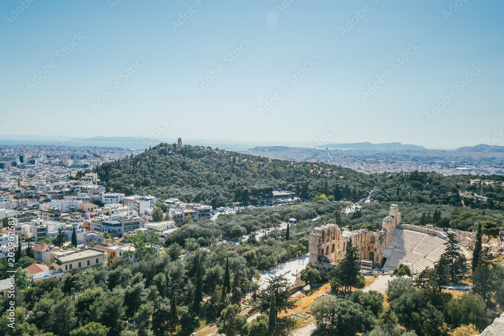Landscape view of Athens with the Odeon of Herodes Atticus and the city on the background