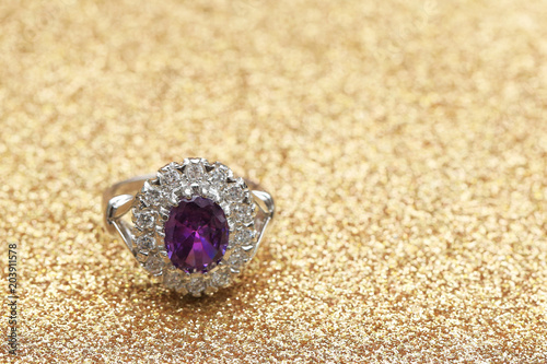 purple gemstone on diamond ring