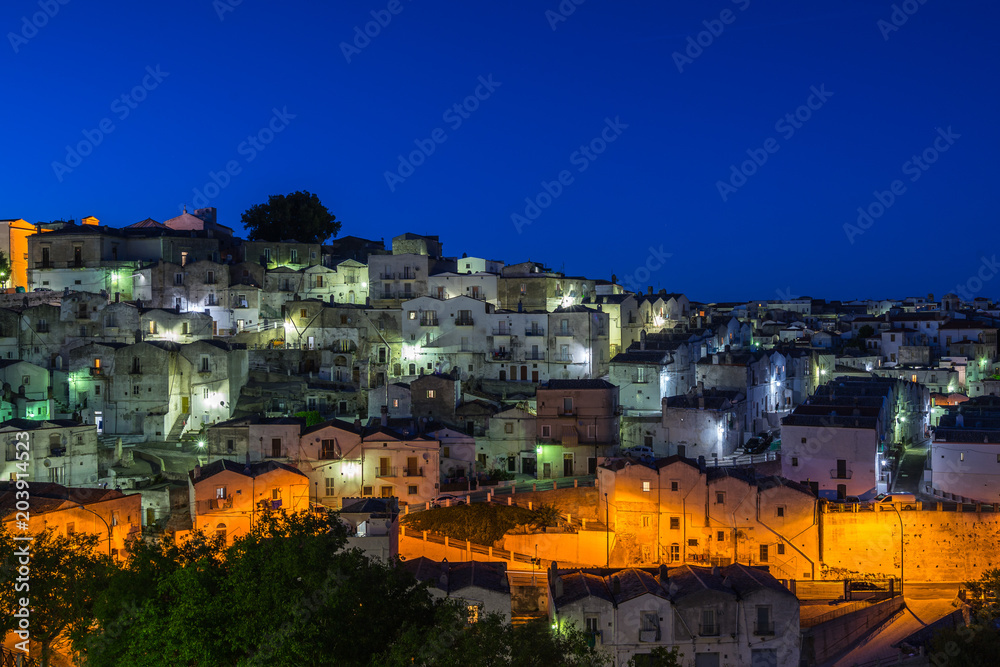 Night cityscape of Monte Sant'Angelo, a typical town in Gargano peninsula, Apulia, Italy