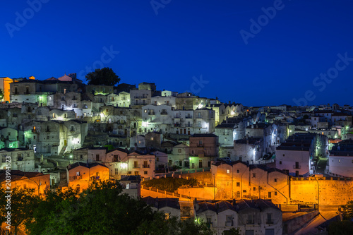 Night cityscape of Monte Sant'Angelo, a typical town in Gargano peninsula, Apulia, Italy