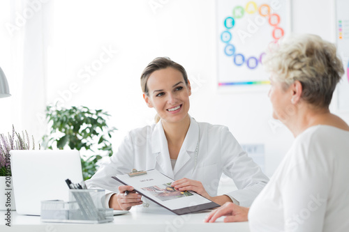 Smiling dietician with her patient