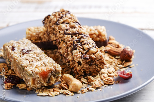 Top view of various healthy granola bars  muesli or cereal bars . Set of energy  sport  breakfast and protein bars isolated on white background