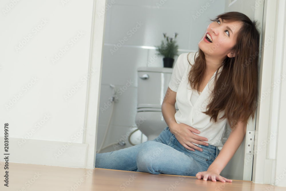 woman in toilet with stomachache or cancer; sick woman suffer from stomachache, gastritis, flatulence, appendicitis, colon cancer, stomach cancer, gastric cancer; asian adult woman health care model woman in toilet with stomachache or cancer; sick woman suffer from stomachache, gastritis, flatulence, appendicitis, colon cancer, stomach cancer, gastric cancer; asian adult woman health care model
