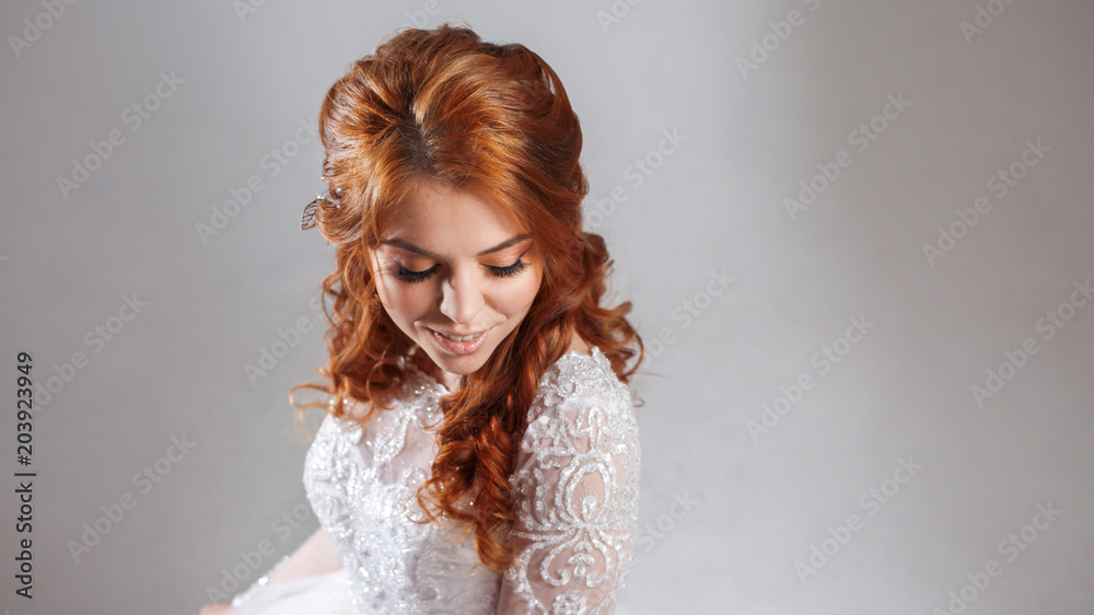 Portrait of a charming red-haired bride, Studio, close-up. Wedding hairstyle and makeup. Portrait of a charming red-haired bride, Studio, close-up. Wedding hairstyle and makeup.