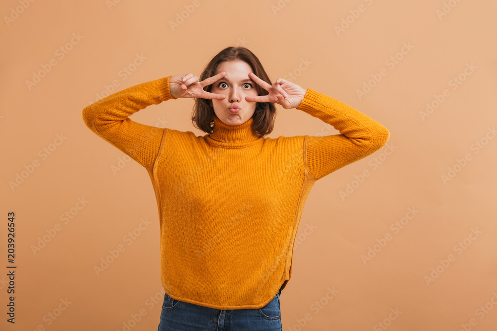 Portrait of a playful young woman in sweater Portrait of a playful young woman in sweater