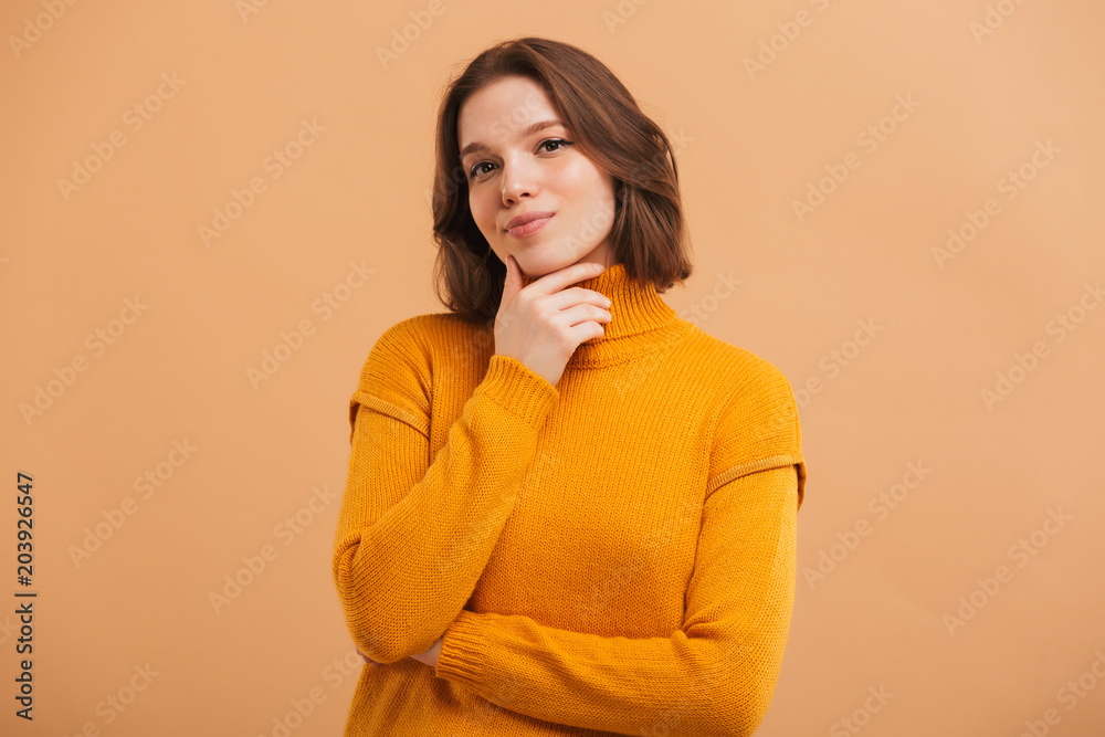 Portrait of a pensive young woman in sweater Portrait of a pensive young woman in sweater