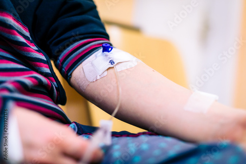Intravenous therapy, infusion or iv in woman hand in hospital.