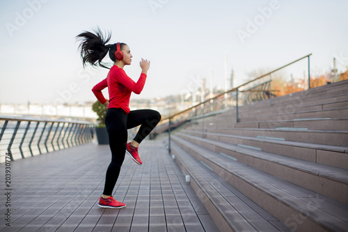 Fototapeta Naklejka Na Ścianę i Meble -  Fitness woman jumping outdoor