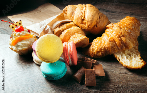 Photography French pastries, desserts: croissants, macaroons, cake, chocolate