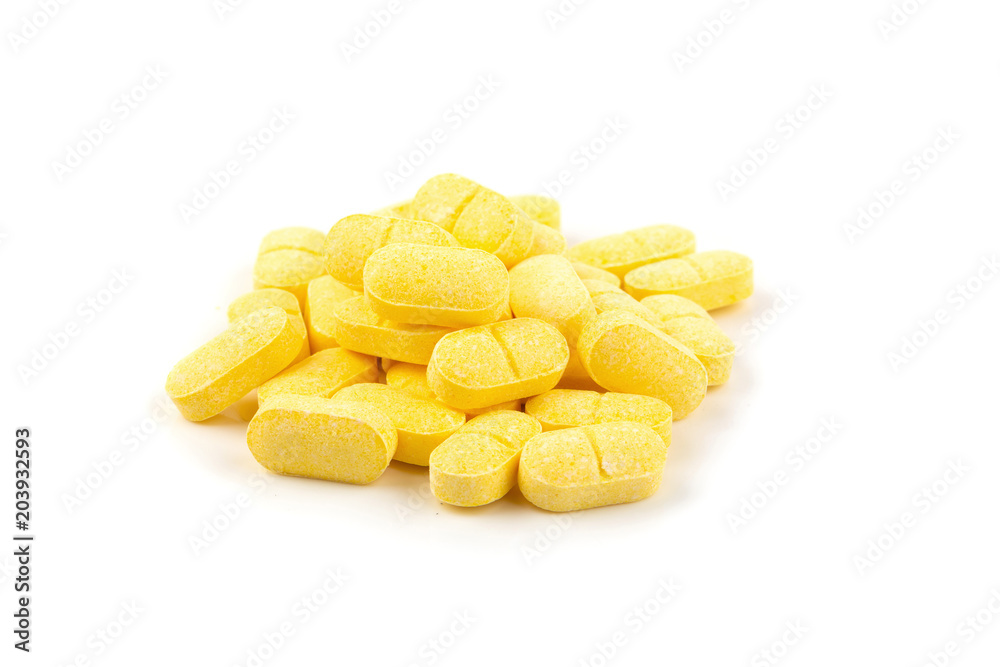Vitamin C, yellow vitamin pills isolated on white background. Vitamin C, yellow vitamin pills isolated on white background.