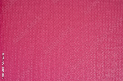 Pink Yoga Mat Rubber Texture Background. Fitness concept, active lifestyle, body care concept
