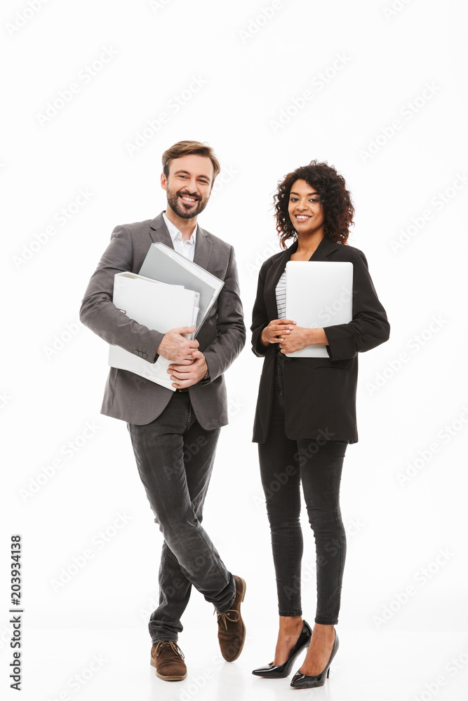 Full length portrait of a business couple holding folders Full length portrait of a business couple holding folders